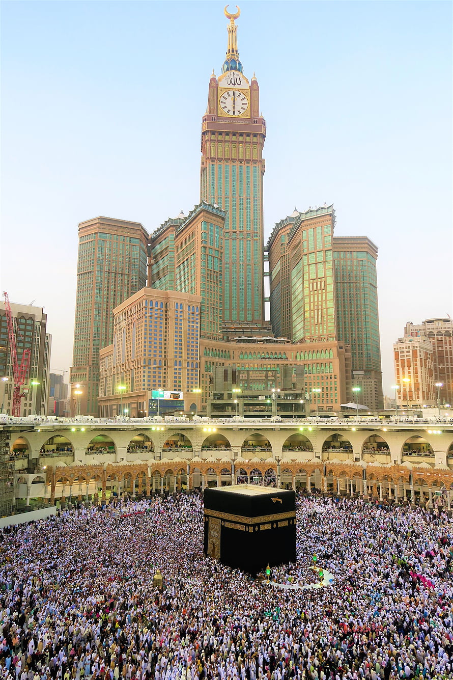 Kaaba in Mecca with Abraj Al Bait Clock Tower and Pilgrims HD phone wallpaper