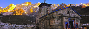 Golden Sunrise Illuminating Kedarnath Temple Against Snowy Himalayan Peaks HD wallpaper