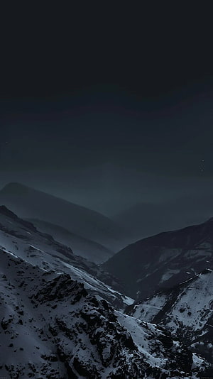 Moody Snow-Covered Mountain Valley at Night with Dark Misty Sky HD phone wallpaper
