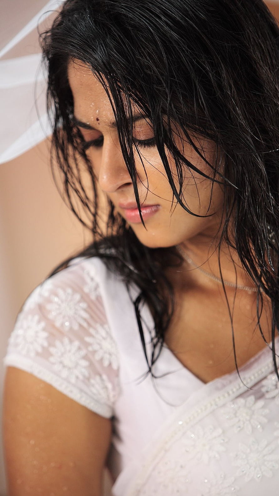 Portrait of a woman with wet hair wearing a white embroidered top, Anushka shetty, telugu actress HD phone wallpaper