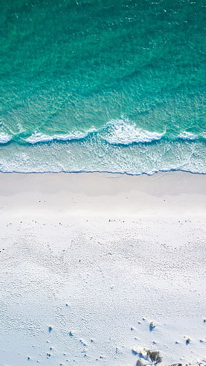 Aerial View of Turquoise Ocean Waves Meeting White Sandy Beach Shoreline HD phone wallpaper