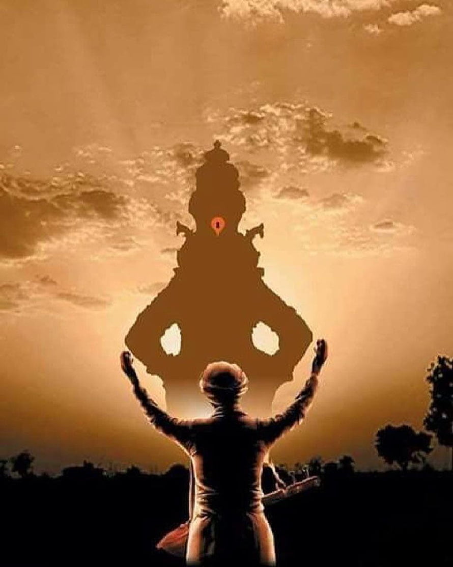 Silhouette of a devotee with raised arms beneath a large Vitthal idol against a golden sunset sky HD phone wallpaper