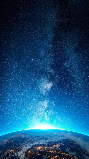 Stunning View of Earth from Space with Milky Way Galaxy and City Lights HD phone wallpaper