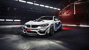 White BMW M4 GT4 Race Car in Dark Garage with Red Accent Lighting HD wallpaper