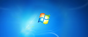 Windows 7 Default Desktop Wallpaper with Colorful Logo on Blue Background HD wallpaper