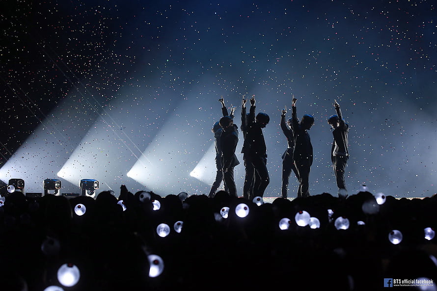 BTS silhouettes on stage with confetti and lightsticks HD wallpaper