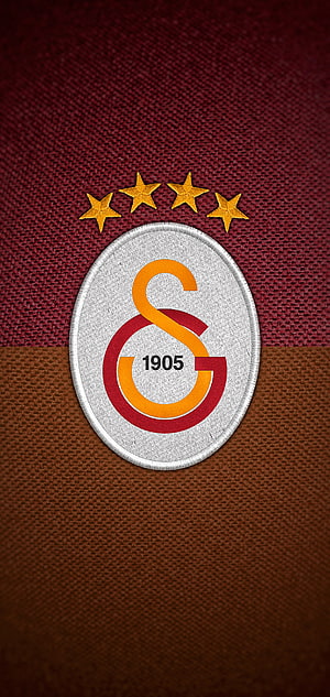 Galatasaray FC Crest Close-Up on Maroon and Brown Jersey Fabric with Four Gold Stars HD phone wallpaper