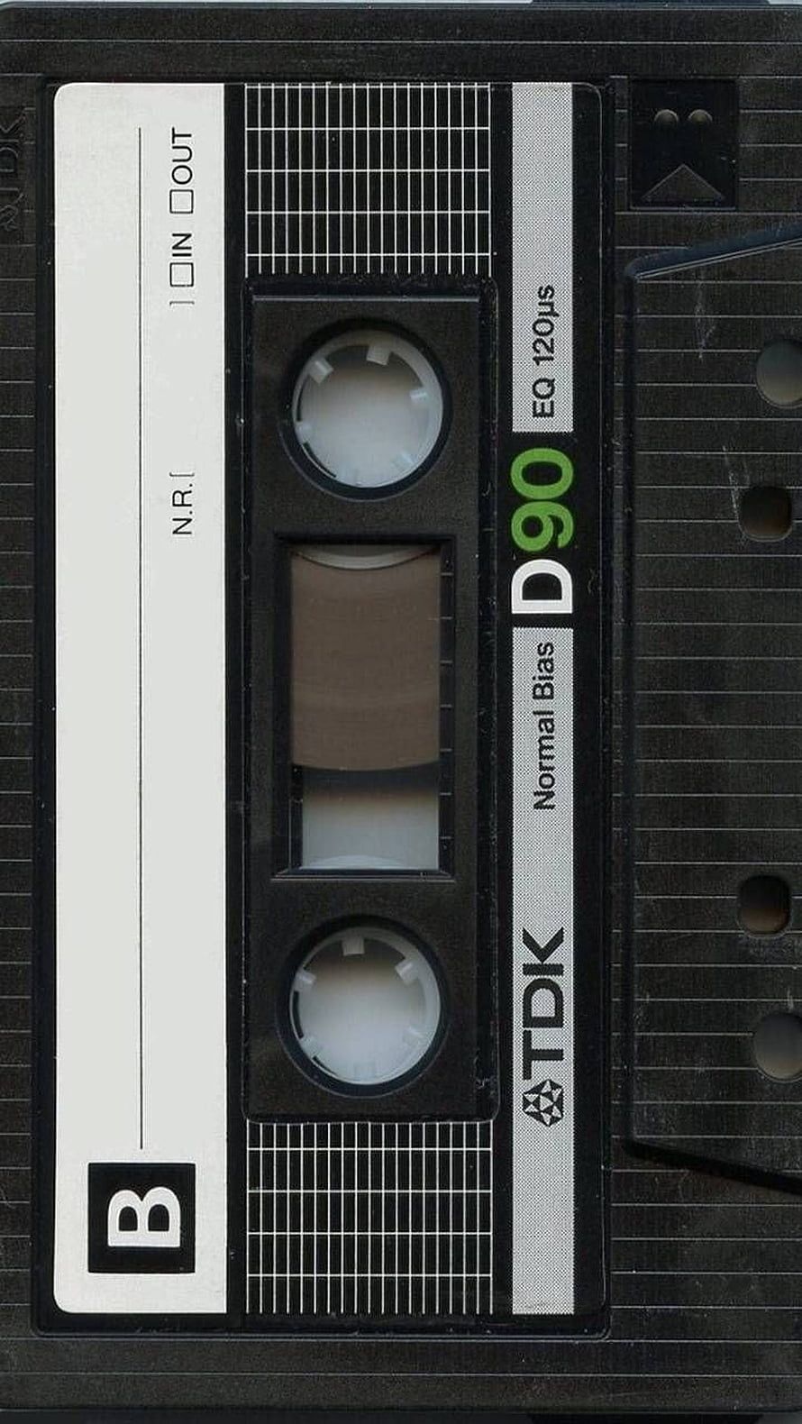 Close-up of a TDK D90 Normal Bias Cassette Tape with Black Shell and White Label HD phone wallpaper