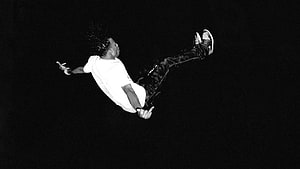 Playboi Carti Mid-Air Jump Black and White Portrait HD wallpaper