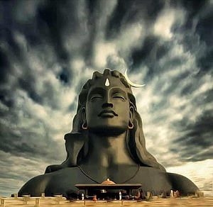 Giant Statue of Lord Shiva with Crescent Moon and Stormy Sky Background HD wallpaper