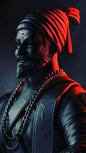 Shivaji Maharaj Sculpture Portrait with Turban and Beaded Necklace in Dramatic Red Lighting HD phone wallpaper