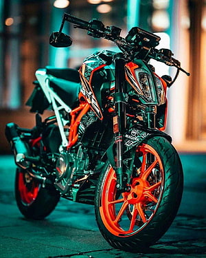 KTM Duke 390 motorcycle with orange wheels and black body parked on a street at night with neon lights HD phone wallpaper