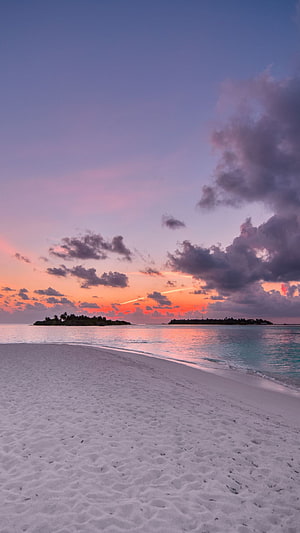 Serene Tropical Beach Sunset with White Sand and Colorful Sky HD phone wallpaper