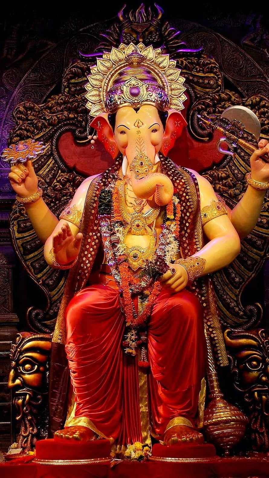 Ornate Ganesha Statue in Red Robes with Golden Crown and Jewelry HD phone wallpaper