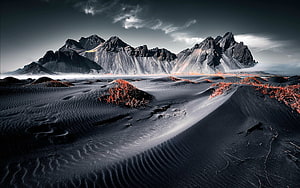 Vestrahorn Mountain and Black Sand Dunes in Iceland Under Dramatic Skies HD wallpaper