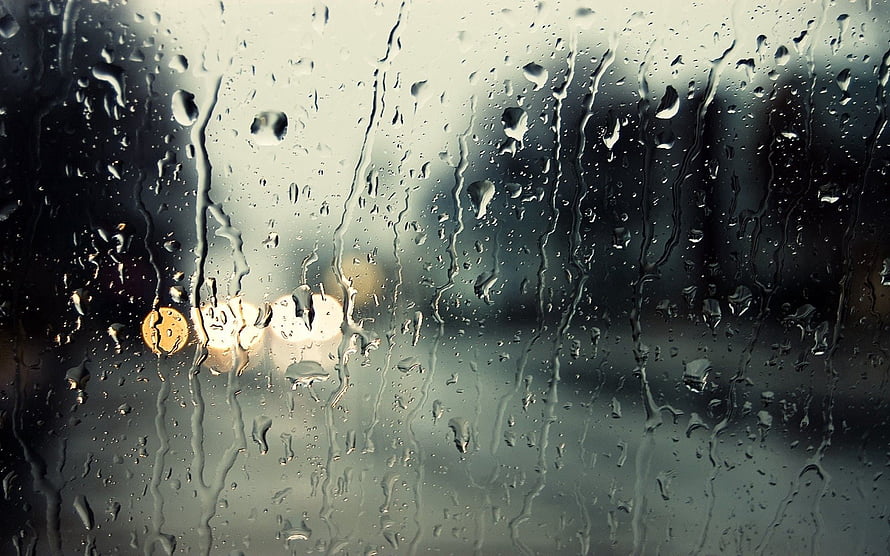 Macro Raindrops on Glass with Blurred City Lights and Water Streaks HD wallpaper