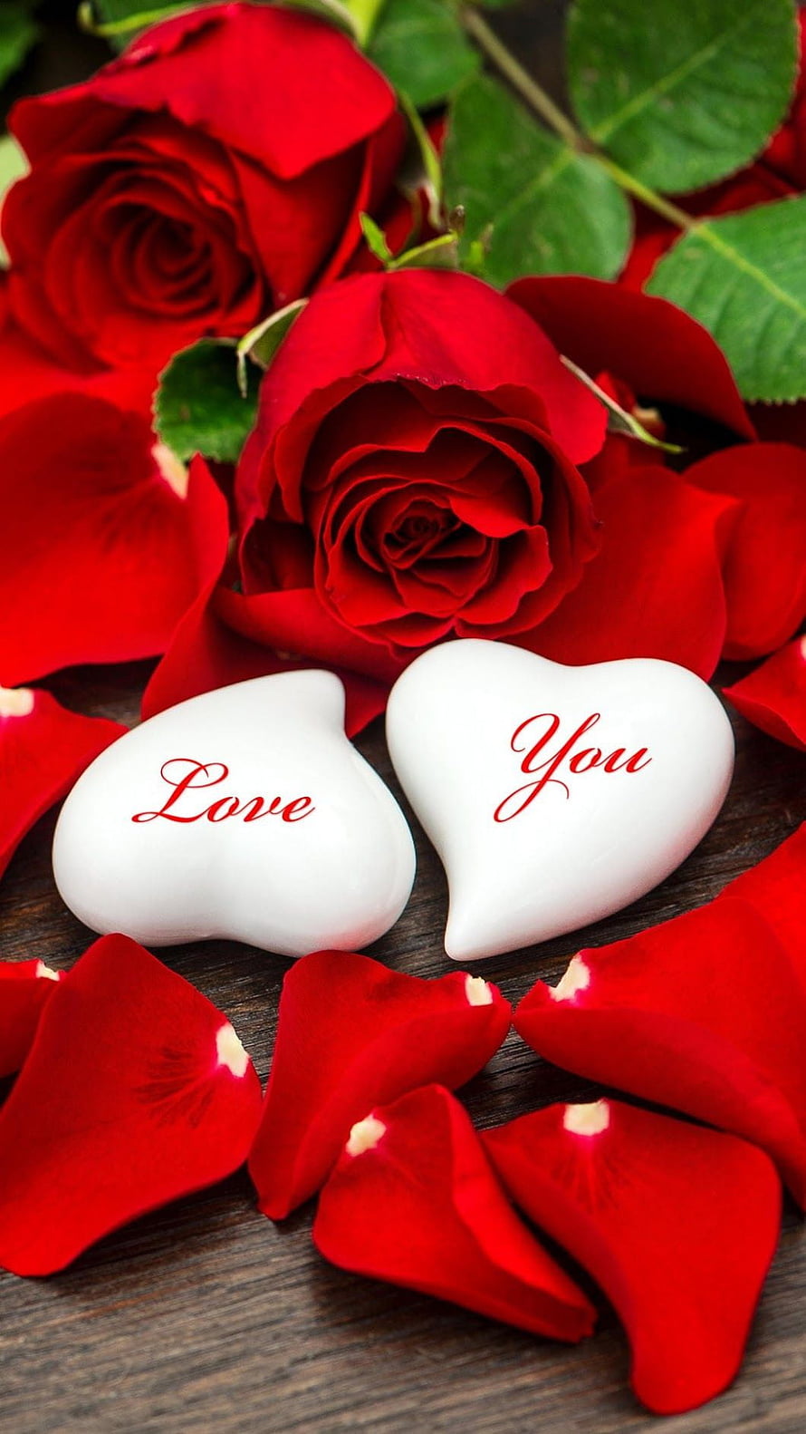 Red Roses and White Heart Stones with Love Message on Wooden Surface HD phone wallpaper