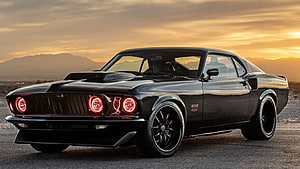 Black Ford Mustang Boss 429 SEMA Show Car with Red LED Headlights at Sunset HD wallpaper