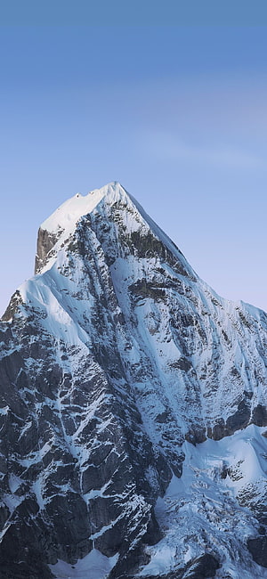Majestic Snow-Capped Mountain Peak Against Clear Blue Sky HD phone wallpaper