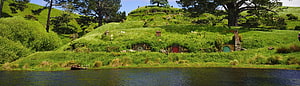 The Shire Hobbiton Movie Set Panorama with Green Hills and Round Doors HD wallpaper