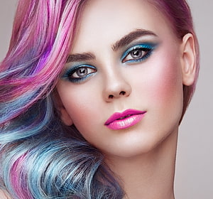 Vibrant Pastel Hair and Bold Blue Eye Makeup Close-Up Portrait HD wallpaper