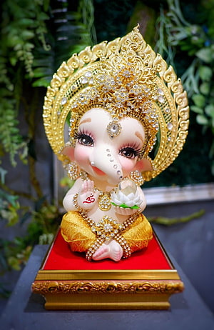 Adorable Baby Ganesha Statue with Golden Crown and Jewels HD phone wallpaper