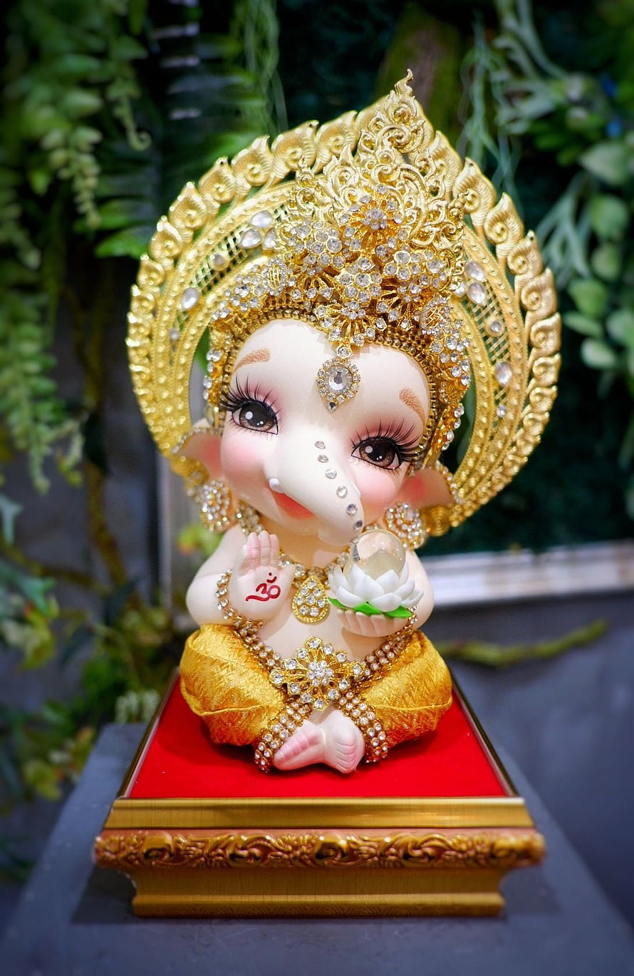 Adorable Baby Ganesha Statue with Golden Crown and Jewels HD phone wallpaper