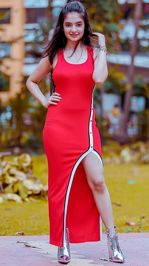 Anushka Sen in a Red High-Slit Maxi Dress with Silver Ankle Boots HD phone wallpaper