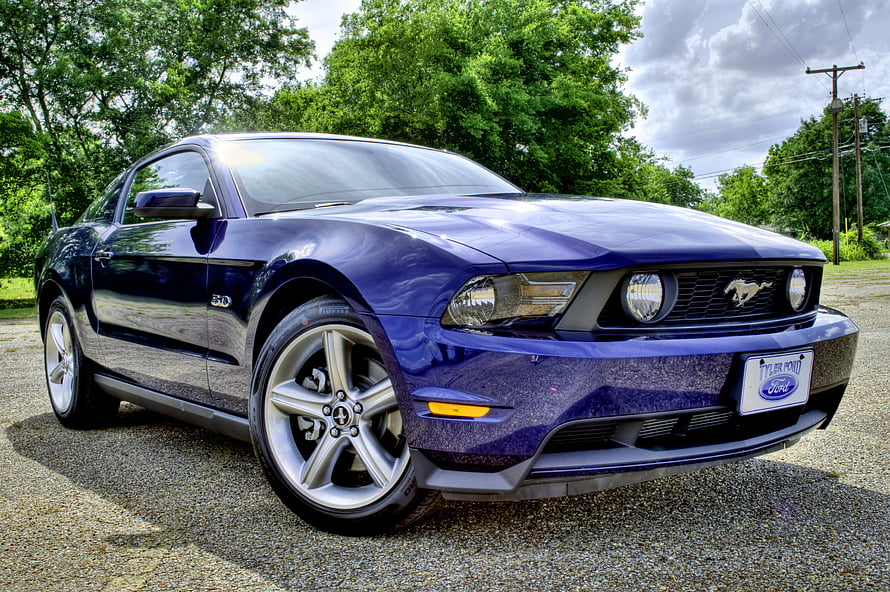 Deep Blue Ford Mustang GT 5.0 Coupe Parked on Gravel with Lush Green Trees HD wallpaper