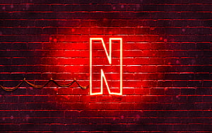 Glowing Netflix N Logo on Dark Red Brick Wall with Neon Light Effect HD wallpaper