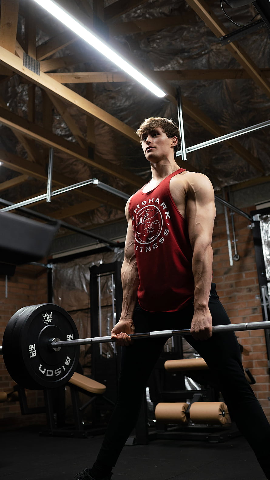 Muscular Athlete Performing Deadlift in Industrial Gym Setting HD phone wallpaper