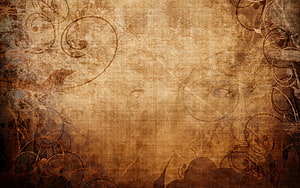 Antique Sepia Textured Background with Ornate Floral Swirls and Vintage Distressed Paper Effect HD wallpaper