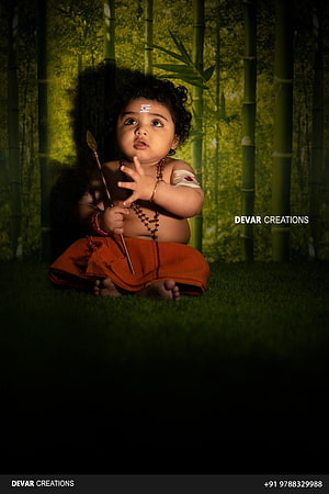 Baby Krishna Portrait in Bamboo Forest with Traditional Hindu Attire and Sacred Markings HD phone wallpaper