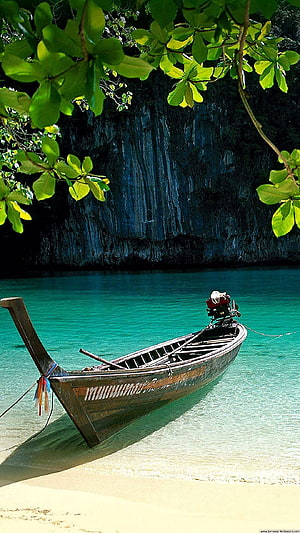 Traditional Thai Longtail Boat Anchored in Turquoise Waters Near Limestone Cliffs HD phone wallpaper
