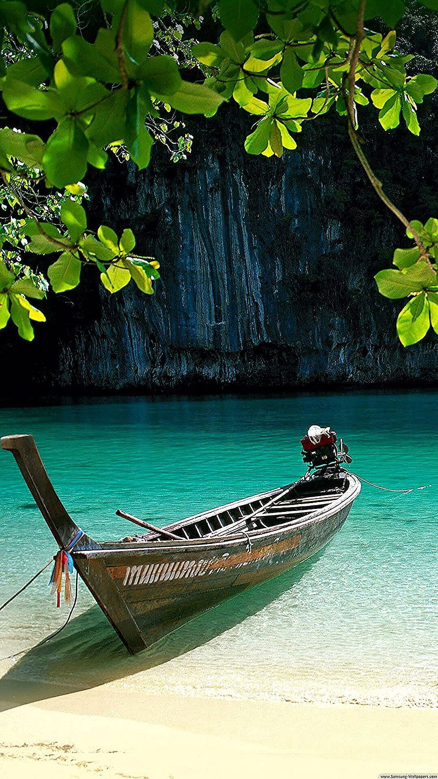 Traditional Thai Longtail Boat Anchored in Turquoise Waters Near Limestone Cliffs HD phone wallpaper