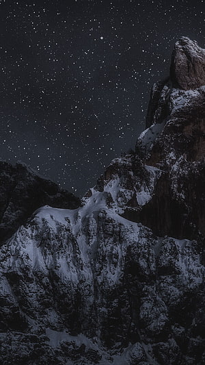 Snow-Capped Mountain Peaks Under a Starry Night Sky HD phone wallpaper