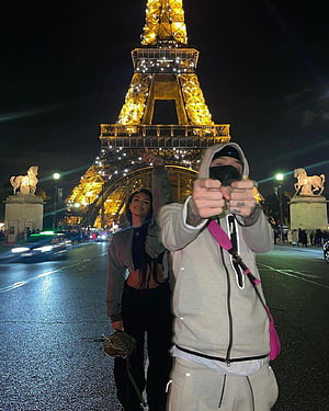 Central Cee and Kenza Taking a Selfie in Front of the Illuminated Eiffel Tower at Night HD phone wallpaper