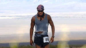 Ultramarathon runner wearing an American flag bandana and race bib number 88 during an endurance event HD wallpaper