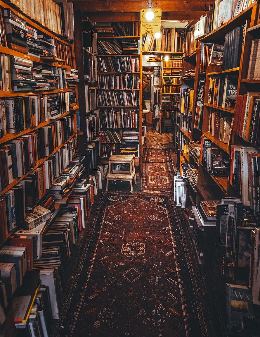 Cozy Vintage Bookstore Interior With Persian Rugs And Wooden Shelves HD phone wallpaper