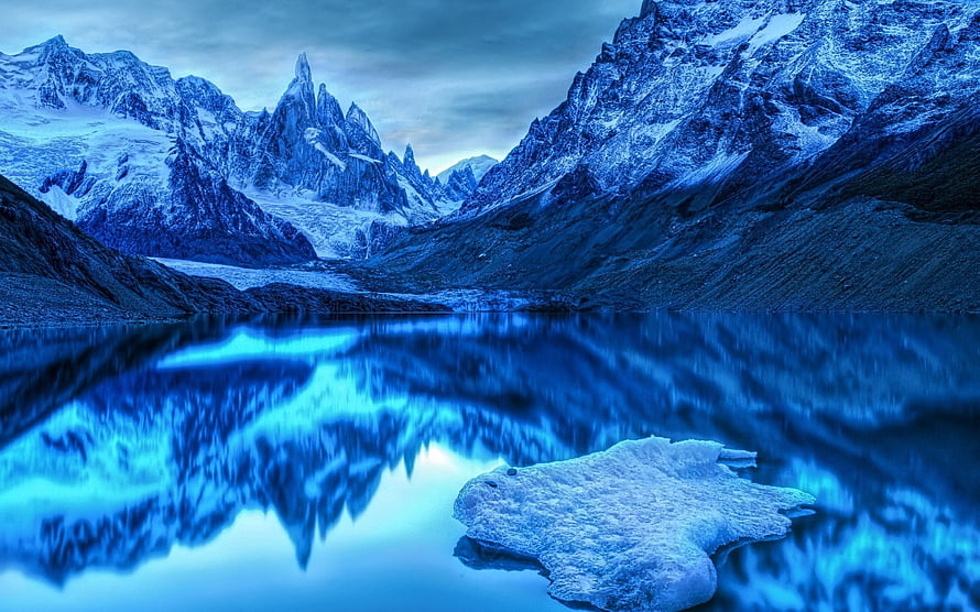 Alpine Lake Reflections: Snow-Capped Peaks and Floating Ice in a Serene Blue Landscape HD wallpaper