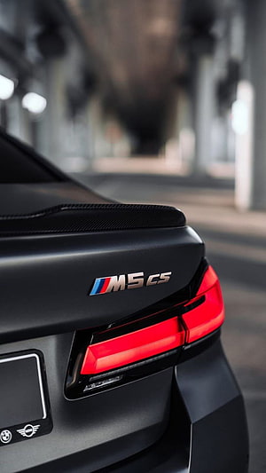 Close-up of BMW M5 CS Rear Spoiler and Taillight Detail HD phone wallpaper