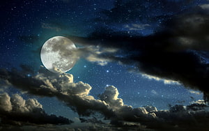 Full Moon Rising Through Dramatic Night Clouds and Starry Sky HD wallpaper