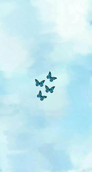Four Blue Morpho Butterflies on a Soft Watercolor Sky Background HD phone wallpaper