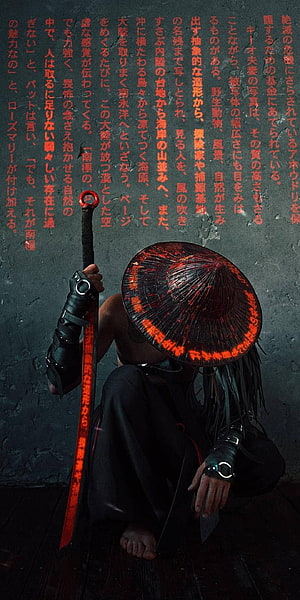 Mysterious warrior in conical hat holding glowing red sword with Japanese text background HD phone wallpaper
