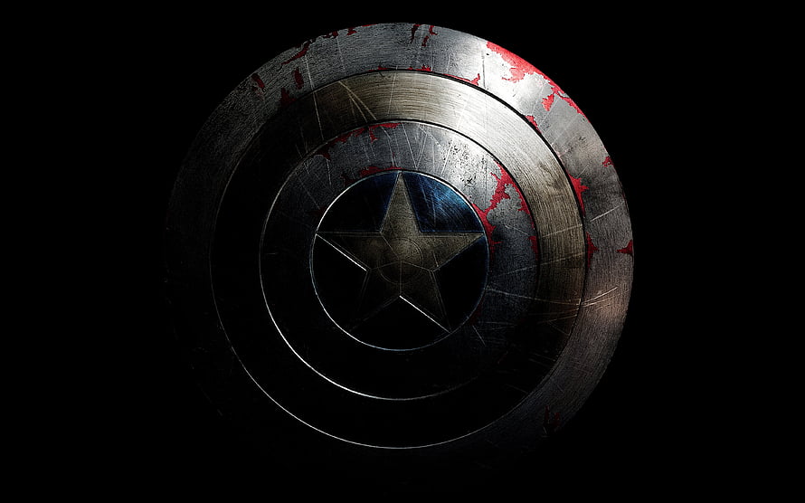 Weathered Captain America Shield with Scratched Metal and Red Accents on Black Background HD wallpaper