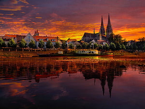 Regensburg Cathedral and Old Town Reflected in the Danube River at Sunset HD wallpaper