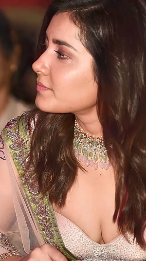 Rashi Khanna in an embroidered green and pink lehenga with a statement necklace HD phone wallpaper