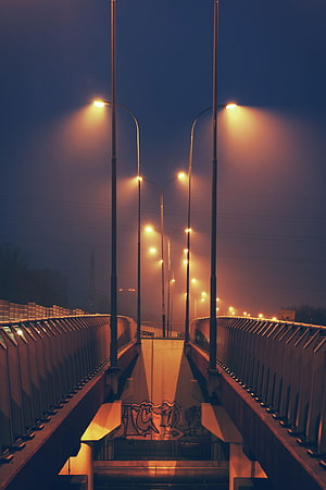 Foggy Urban Pedestrian Bridge at Night with Glowing Streetlights HD phone wallpaper