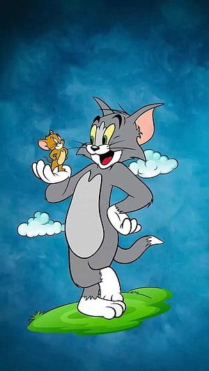 Tom and Jerry Cartoon Characters Standing on Grass Patch Against Blue Sky Background HD phone wallpaper