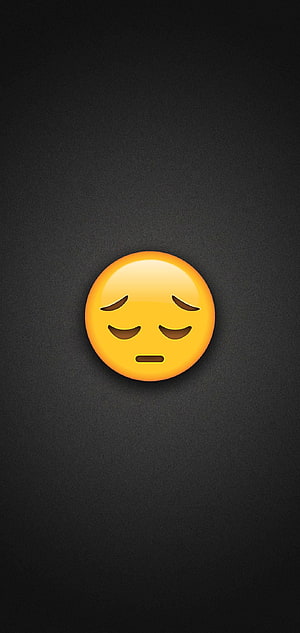 Sad Pleading Face Emoji on Dark Textured Background HD phone wallpaper